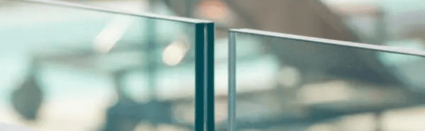 Edge of laminated glass showing two panels of glass with the protective inter-layer sandwhiched between them.